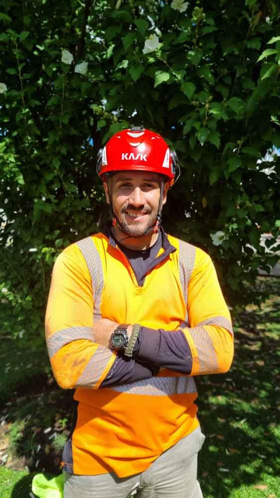 equipo1 a group of men standing next to each other near a tree